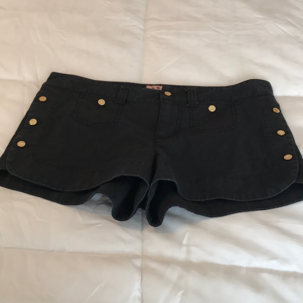 Black cotton shorts with brass button detail